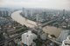 Thailand: The Chao Phraya River snakes its way through Bangkok. Looking south over the King Taksin Bridge from the State Tower, Bangkok