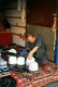China: Uighur milliner (hatmaker), Old Town, Kashgar, Xinjiang Province