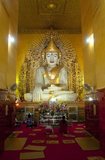 The Kyauktawgyi Temple was built during the reign of King Mindon Min (b. 1808 - 1878). The temple is renowned for its giant seated Buddha carved from a single block of pale green marble.<br/><br/>

Mandalay, a sprawling city of more than 1 million people, was founded in 1857 by King Mindon to coincide with an ancient Buddhist prophecy. It was believed that Gautama Buddha visited the sacred mount of Mandalay Hill with his disciple Ananda, and proclaimed that on the 2,400th anniversary of his death, a metropolis of Buddhist teaching would be founded at the foot of the hill.