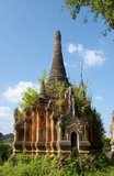 Nyaung Ohak and the Shwe Indein Pagoda are collections of Buddhist stupas dating back to the 17th and 18th centuries CE.<br/><br/>

Inle Lake is a freshwater lake located in the Nyaungshwe Township of Taunggyi District of Shan State, part of Shan Hills in Myanmar (Burma). It is the second largest lake in Myanmar with an estimated surface area of 44.9 square miles (116 km2), and one of the highest at an altitude of 2,900 feet (880 m).<br/><br/>

The people of Inle Lake (called Intha), some 70,000 of them, live in four cities bordering the lake, in numerous small villages along the lake's shores, and on the lake itself. The entire lake area is in Nyaung Shwe township. The population consists predominantly of Intha, with a mix of other Shan, Taungyo, Pa-O (Taungthu), Danu, Kayah, Danaw and Bamar ethnicities. Most are devout Buddhists, and live in simple houses of wood and woven bamboo on stilts; they are largely self-sufficient farmers.<br/><br/>

Most transportation on the lake is traditionally by small boats, or by somewhat larger boats fitted with single cylinder inboard diesel engines. Local fishermen are known for practicing a distinctive rowing style which involves standing at the stern on one leg and wrapping the other leg around the oar. This unique style evolved for the reason that the lake is covered by reeds and floating plants making it difficult to see above them while sitting. Standing provides the rower with a view beyond the reeds. However, the leg rowing style is only practiced by the men. Women row in the customary style, using the oar with their hands, sitting cross legged at the stern.
