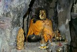 Wat Chakkrawat is famous for its live crocodiles and also a small grotto containing what is called a Buddha shadow. Visitors press gold leaf on the shadow shape.