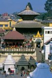 The most revered Hindu site in Nepal is the extensive Pashupatinath Temple complex, five kilometres east of central Kathmandu. The focus of devotion here is a large silver Shivalingam with four faces of Shiva carved on its sides, making it a 'Chaturmukhi-Linga', or four-faced Shivalingam. Pashupati is one of Shiva’s 1,008 names, his manifestation as 'Lord of all Beasts' (pashu means 'beasts', pati means 'lord'); he is considered the guardian deity of Nepal.<br/><br/> 

The main temple building around the Shivalingam was built under King Birpalendra Malla in 1696, however the temple is said to have already existed before 533 CE. In 733 CE, King Jayadeva II erected in its precincts a stone tablet which chronicled all the kings of Nepal, beginning with the sun god. During the Muslim raids of 1349 the temple was largely destroyed, but in 1381 Jayasinharama Varddhana of Banepa restored it. Further renovations were conducted towards the end of the Malla period, and the latest extensive improvements were made in 1967.<br/><br/> 

Since the temple's inception, all the rulers of Nepal have taken great pains to pay their respects to it, to make donations, and to finance extensions.