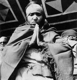 Phoolan Devi (10 August 1963 – 25 July 2001), popularly known as 'Bandit Queen', was an Indian bandit and later a politician. Born to a low caste family in rural Uttar Pradesh, Devi's early years were characterised by numerous incidents of sexual abuse, followed by a criminal career she later became known for.<br/><br/>

At the age of 18 Devi was gang-raped by high-caste bandits after the gang she was part of was ambushed by rivals. As a result of this incident she became a gang leader in her own right and sought revenge. In 1981 Devi and her gang returned to the village where she had been raped and 22 Thakur caste villagers, including two of her rapists, were rounded up and executed.<br/><br/>

The press portrayed the Behmai massacre as an act of righteous lower-caste rebellion and Devi herself as an oppressed feminist Robin Hood. Indian police authorities argue that there is no recorded instance of Devi helping those in need.<br/><br/>

Devi and surviving gang members evaded capture for 2 years before surrendering in 1983. She was charged for 48 crimes, including murder, plunder, arson and kidnapping for ransom. After 11 years pending trial, the state government withdrew all charges against her and she was released in 1994. She then ran for election as a candidate of the Samajwadi Party and was elected to parliament.<br/><br/>

In 2001 Devi was assassinated in New Delhi by a trio of upper-caste men.
