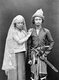 Indonesia / Sumatra: Armed Acehnese man posing with his wife, Banda Aceh, c. 1900. Aceh War (1873 - 1914)