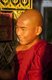 Burma / Myanmar: Late afternoon light illuminates a Buddhist monk at the Sutaungpyei Pagoda at the summit of Mandalay Hill, Mandalay