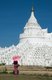 The Hsinbyume Pagoda was built in 1816 by King Bagyidaw (1784 - 1846), the seventh king of the Konbaung Dynasty. He built it for his first wife, Princess Hsinbyume who died in childbirth in 1812. The pagoda is also known as the Myatheindan Pagoda.<br/><br/>

The pagoda's design is based on the mythical Sulamani Pagoda found on Mount Meru, with the seven lower concentric terraces representing the mountain ranges leading to Mount Meru.