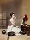 Japan: Studio photograph of a woman applying make-up. Attributed to Kusakabe Kimbei, c. 1885