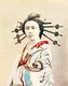 Japan: An <i>oiran</i> or courtesan - readily identifiable by her extravagantly large hair pins. Attributed to Shuzaburo Usui, c. 1885