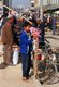 China: A young garlic vendor, Sunday Market, Kashgar, Xinjiang Province