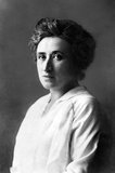 Rosa Luxemburg (also Rozalia Luxenburg; Polish: Róża Luksemburg; 5 March 1871 – 15 January 1919) was a Marxist theorist, philosopher, economist and revolutionary socialist of Polish-Jewish descent who became a naturalized German citizen. She was, successively, a member of the Social Democracy of the Kingdom of Poland and Lithuania (SDKPiL), the Social Democratic Party of Germany (SPD), the Independent Social Democratic Party (USPD), and the Communist Party of Germany (KPD).<br/><br/>

In 1915, after the SPD supported German involvement in World War I, she and Karl Liebknecht co-founded the anti-war Spartakusbund ('Spartacus League'), which eventually became the Communist Party of Germany (KPD). During the German Revolution she co-founded the newspaper Die Rote Fahne ('The Red Flag'), the central organ of the Spartacist movement.<br/><br/>

She considered the Spartacist uprising of January 1919 a blunder, but supported it as events unfolded. With the crushing of the revolt by Friedrich Ebert's social democratic government, Freikorps troops captured Luxemburg, Liebknecht and some of their supporters. Luxemburg was shot and her body thrown in the Landwehr Canal in Berlin.