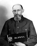 In 1933 Blobel joined the police force in Düsseldorf. In June 1934 he was recruited into the SD or Sicherheitsdienst, the security service of the SS and the Nazi Party. In June 1941 he became the commanding officer of Sonderkommando 4a of Einsatzgruppe C that was active in the Ukraine. Following Wehrmacht troops into the Ukraine, the Einsatzgruppen would be responsible for liquidating political and racial undesirables.<br/><br/>

Blobel, in conjunction with Reichenau's and Friedrich Jeckeln's units, organized the Babi Yar massacre in late September 1941 in Kiev, where 33,771 Jews were murdered. Up to 59,018 killings are attributable to Blobel, though during testimony he was alleged to have killed 10,000–15,000. He was later sentenced to death by the U.S. Nuremberg Military Tribunal in the Einsatzgruppen Trial. He was hanged at Landsberg Prison shortly after midnight on 7 June 1951.