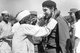 India / Cuba: An elderly villager in a Gandhi cap garlanding Che Guevara during his visit to a Community Project Area in Delhi, 1959