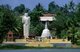 Sri Lanka: A small Buddhist temple with a standing Buddha and chedi on the outskirts of Kandy