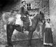 Turkey / Kurdistan: A mounted Kurdish man posing with his horse held by a young girl, c. 1910