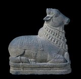 Nandi or Nandin (Tamil: நந்தி Sanskrit: नंदी) is the name for the bull which serves as the mount (Sanskrit: vāhana) of Shiva and as the gate keeper of Shiva and Parvati in Hindu mythology.<br/><br/>

Temples venerating Shiva and Parvati display stone images of a seated Nandi, generally facing the main shrine. There are also a number of temples dedicated solely to Nandi.