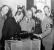 Germany: Ferdinand Porsche (left), Robert Ley (centre, head of the German Labour Front, 1933 to 1945) and Adolf Hitler examine a prototype model of the Volkswagen Beetle, 1935