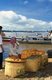 Cambodia: Baguette vendor sits next to the Mekong River, Kompong Cham