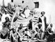 Zanzibar: E.D. Moore, ivory buyer for Pratt, Read & Co., Deep River, Connecticut, reclines atop Zanzibar's largest shipment of tusks — 355 tusks weighing 22,000 pounds, circa 1900