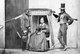 Brazil: Studio portrait of a prosperous Portuguese Brazilian woman seated in her litter, flanked by two rather elegantly dressed slaves, Sao Paulo, c.1860