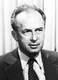 Yitzhak Rabin (1 March 1922 – 4 November 1995) was an Israeli politician, statesman and general. He was the fifth Prime Minister of Israel, serving two terms in office, 1974–77 and 1992 until his assassination in 1995.<br/><br/>

Rabin led a 27-year career as a soldier. As a teenager he joined the Palmach, the commando force of the Yishuv. He eventually rose through its ranks to become its chief of operations during Israel's War of Independence. He joined the newly formed Israel Defense Forces in late 1948 and continued to rise as a promising officer. He helped shape the training doctrine of the IDF in the early 1950s, and led the IDF's Operations Directorate from 1959–1963. He was appointed Chief of the General Staff in 1964 and oversaw Israel's decisive victory in the 1967 Six-Day War.<br/><br/>

He was appointed Prime Minister of Israel in 1974, after the resignation of Golda Meir. In his first term, Rabin signed the Sinai Interim Agreement and ordered the Entebbe raid. He resigned in 1977 in the wake of a financial scandal. Rabin was Israel's minister of defense for much of the 1980s, including during the outbreak of the First Intifada.<br/><br/>

In 1992, Rabin was re-elected as prime minister on a platform embracing the Israeli–Palestinian peace process. He signed several historic agreements with the Palestinian leadership as part of the Oslo Accords. In 1994, Rabin won the Nobel Peace Prize together with long-time political rival Shimon Peres and Palestinian leader Yasir Arafat. In November 1995, he was assassinated by a right-wing Israeli radical named Yigal Amir, who was opposed to the peace process.