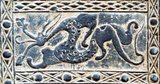 A pottery tile of the Han Dynasty, depicting hunting and battle scenes containing emblematic figures of the 'five cardinal directions' (the four cardinal directions plus the centre).<br/><br/>

The Four Symbols (Chinese: 四象; pinyin: Sì Xiàng) are four mythological creatures in the Chinese constellations. They are the Azure Dragon, of the East, the Vermilion Bird of the South, the White Tiger of the West, and the Black Turtle of the North. Each one of them represents a direction and a season, and each has its own individual characteristics and origins. Symbolically and as part of spiritual and religious belief, they have been culturally important in China, Korea, Vietnam, and Japan