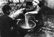 Vietnam: A man and woman use bomb powder to manufacture mines, Cu Chi, South Vietnam, Second Indochina War (Vietnam War) (1966)