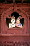 In the late 18th century CE, Rana Bahadur Shah, the grandson of Prithvi Narayan Shah, built a Shiva-Parvati Temple on Durbar Square, which was also, in a way, to become a monument to the joys—or vagaries—of married life.<br/><br/>

The temple, built on a platform formerly used for dance performances, is dedicated to the divine couple Shiva and Parvati. From an arched, carved window in its upper storey two wooden figures representing Shiva and Parvati look down on the square below. The figures are extraordinarily life-like, and from a distance one may almost be fooled. Their elbows casually rest on the windowsill, and the couple appears the very image of wedded bliss.