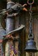 Nepal: A temple bell next to a pillar entwined by a dragon at the Rudra Varna Mahavihar temple, Patan, Kathmandu Valley (1998)