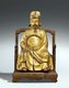 China: Lacquer and gilt wooden figure of General Tian Hongzheng (764-821) seated in a chair wearing the robe and cap of a Tang Dynasty civil servant. The chair bears the inscription 'Hongshen Gong'. Southern China, Qing Dynasty