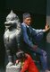 Nepal: A man rests against a guardian lion at the Kasthamandap Temple, Durbar Square, Kathmandu (1996)