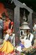 Nepal: Two men on pilgrimage sit next to a temple bell at Kumbeshwar Temple, Patan, Kathmandu Valley (1996)