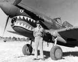 'Flying Tigers' was the popular name of the 1st American Volunteer Group (AVG) of the Chinese Air Force in 1941-1942. The pilots were United States Army (USAAF), Navy (USN), and Marine Corps (USMC) personnel, recruited under Presidential sanction and commanded by Claire Lee Chennault; the ground crew and headquarters staff were likewise mostly recruited from the U.S. military, along with some civilians.<br/><br/>

The group consisted of three fighter squadrons with about 20 aircraft each. It trained in Burma before the American entry into World War II with the mission of defending China against Japanese forces. The Tigers' shark-faced fighters remain among the most recognizable of any individual combat aircraft of World War II, and they demonstrated innovative tactical victories when the news in the U.S. was filled with little more than stories of defeat at the hands of the Japanese forces.
