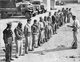 Israel / Palestine: Soldiers of the Israeli Palmach (Negev Brigade) receive orders before participating in 'Operation Yoav', Arab-Israeli War, 1948