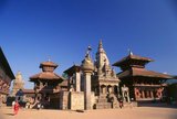 That the Durbar Square of Bhaktapur appears so much less cluttered than its counterparts in Kathmandu and Patan is simply due to the earthquake of 1934. The earthquake devastated a large number of buildings in the square and they were never reconstructed.<br/><br/>

A minor earthquake in 1988 did further damage. According to the Nepalese chronicles, Bhupatindra Malla had laid out 99 courtyards within the palace compound; in 1742, only 12 remained, and today there are but six.<br/><br/>

Durbar Square is now a relatively large open space, surrounded by buildings on its fringes but clear of any constructions in the centre. On the west side, the square is accessed through Durbar Square Gate, built by Bhupatindra Malla (1696-1722) as a main entry point to the area. He also erected the figures of monkey god Hanuman and Narasinha, the half-man, half-lion deity, along the lines of the Hanuman and Narasinha figures near the palace gate in Kathmandu.