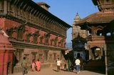 The southeastern part of Bhaktapur's Royal Palace compound is taken up by the Palace of Fifty-Five Windows, which was the actual residence of the Bhaktapur kings. The three-storied building boasts some masterly carved doors and windows on its lower floors, and on the third floor there are 55 arcaded windows. In its original form, the upper floor projected out from the building, but after the 1934 earthquake it was reconstructed in the present style.<br/><br/>

Inside the compound there is a golden water conduit, laid out in 1688, which brought in water from a source 11 kilometres away. The water was used for the daily ritual bathing of the image of goddess Taleju. Also fed by a subterranean water conduit was the Nag Pokhri, or 'Pond of the Nagas', located at the northeastern corner of the temple complex and constructed during the reign of Jagatprakasha Malla (1743-1772).
