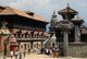 Nepal: Durbar Square with King Bhupatindra Malla sitting on top of his column (centre) looking towards the 55 Window Palace, Bhaktapur, Kathmandu Valley (1997)