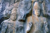 The remote ancient Buddhist site of Buduruvagala (which means ‘stone Buddha images’ in Sinhalese) is thought to date from the 10th century, when Mahayana Buddhism dominated parts of Sri Lanka. Carved into the rock face is a huge 16m-high Buddha figure, with three smaller figures on either side. These are thought to represent the Maitreya Buddha, Avalokitesvara and his consort Tara, as well as the Hindu god Vishnu.