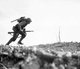 Japan / USA: Marine Paul E. Ison charges across 'Death Valley' on April 1, 1945. Battle of Okinawa