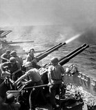 On December 7–8, 1941, Japanese forces carried out surprise attacks on Pearl Harbor, attacks on British forces in Malaya, Singapore, and Hong Kong and declared war, bringing the US and the UK into World War II in the Pacific.<br/><br/>

After the Soviet invasion of Manchuria and the atomic bombings of Hiroshima and Nagasaki in 1945, Japan agreed to an unconditional surrender on August 15. The war cost Japan and the rest of the Greater East Asia Co-Prosperity Sphere millions of lives and left much of the nation's industry and infrastructure destroyed.