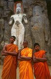 The remote ancient Buddhist site of Buduruvagala (which means ‘stone Buddha images’ in Sinhalese) is thought to date from the 10th century, when Mahayana Buddhism dominated parts of Sri Lanka. Carved into the rock face is a huge 16m-high Buddha figure, with three smaller figures on either side.<br/><br/>

Avalokiteśvara ('Lord who looks down') is a bodhisattva who embodies the compassion of all Buddhas. Portrayed in different cultures as either male or female, Avalokiteśvara is one of the more widely revered bodhisattvas in mainstream Mahayana Buddhism, as well as unofficially in Theravada Buddhism.