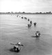 Burma / Myanmar: Indian Army soldiers wade ashore at Akyab to battle the Japanese during the Burma Campaign. Akyab (now, Sittwe), Rakhine State, January 1945