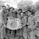 Burma / Myanmar: Scottish soldiers of the Royal Scots infantry with a Japanese flag captured after clearing Japanese forces from a village. Payan, Sagaing, January 1945