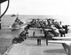 USA / Japan: Some of the B-25 Mitchell Bombers of the Doolittle Raiders crowd the rear deck of the USS Hornet with two escort vessels following close in the background, north Pacific, April 1942