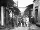 USA / Japan / China: Four unidentified Doolittle Raid crewmen, who bailed out over China from Aircraft no. 14, are escorted through a Chinese town before being reunited with other airmen, April 1942