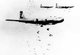USA / Japan: A flight of USAAF B-29 bombers release incendiary bombs on Yokohama in May 1945