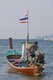 Thailand: A local boatman readies his boat at Bang Thao Beach (Hat Bang Thao), Phuket