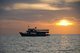 Thailand: A dive boat anchored at sunset near Sai Khao Beach ( Hat Sai Khao), Ko Chang, Trat Province