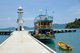 Thailand: Dive boat at the pier next to the lighthouse, Bang Bao fishing village, Ko Chang, Trat Province