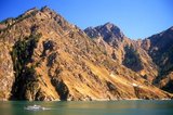 Tian Chi or ‘Heaven Lake’ is 110km east of Urumqi. The long, blue lake is at an altitude of 2,000m and lies in the lee of permanently snow-capped Bogda Feng, ‘The Peak of God’, at 5,445m the highest mountain in the eastern Tian Shan.<br/><br/>

During the summer months Kazakh yurts cluster by the lake shore. In winter even the hardy Kazakhs move down to lower pastures.