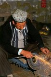 The small Uighur-dominated oasis of Yengisar (Yingjisha) is known throughout the western Chinese province of Xinjiang for its production of handmade knives. The Small Knife Factory (Pichak Chilik Karakhana / Xiadaochang) employs skilled local craftsmen producing fine knives with inlaid handles. Just about every Uighur man carries a knife, both as a sign of manhood and for the more utilitarian purpose of cutting up melons, and the most valued (and expensive) come from Yengisar.